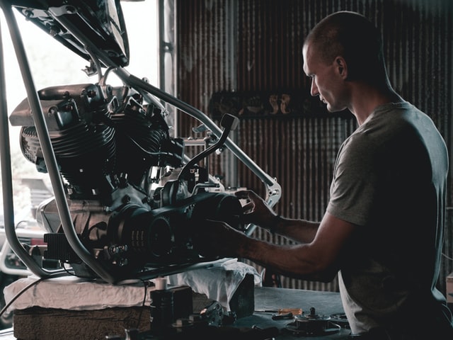 auto mechanic fixing engine